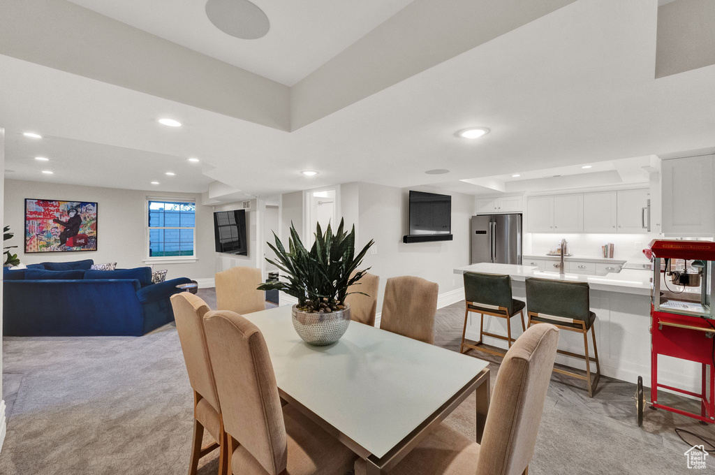 Dining area with light carpet