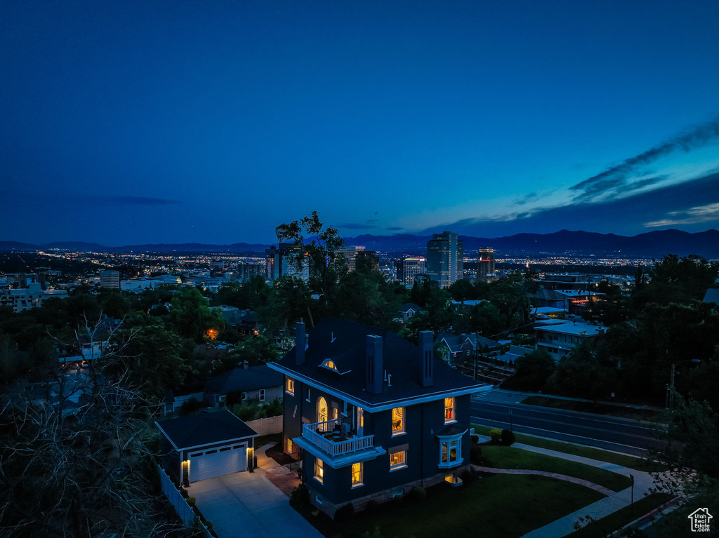 Aerial view at dusk featuring a mountain view