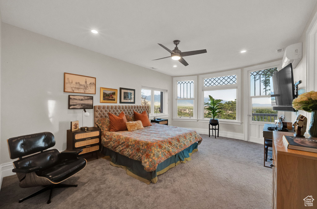 Bedroom featuring carpet flooring, ceiling fan, and multiple windows