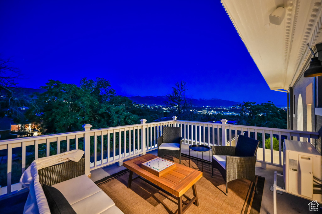 Deck at night with an outdoor living space