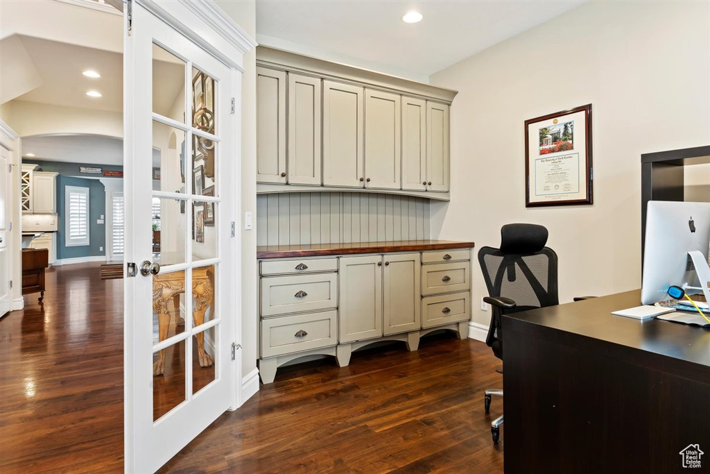 Office featuring dark hardwood / wood-style floors and french doors
