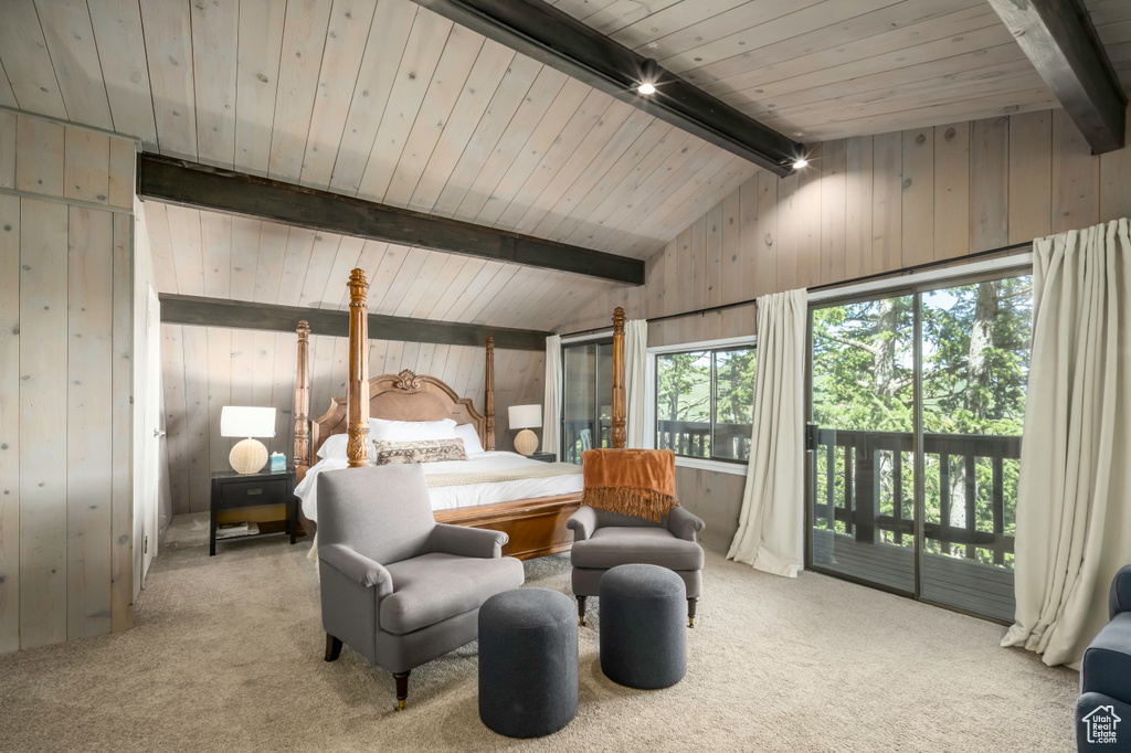 Bedroom featuring light colored carpet, multiple windows, and lofted ceiling with beams