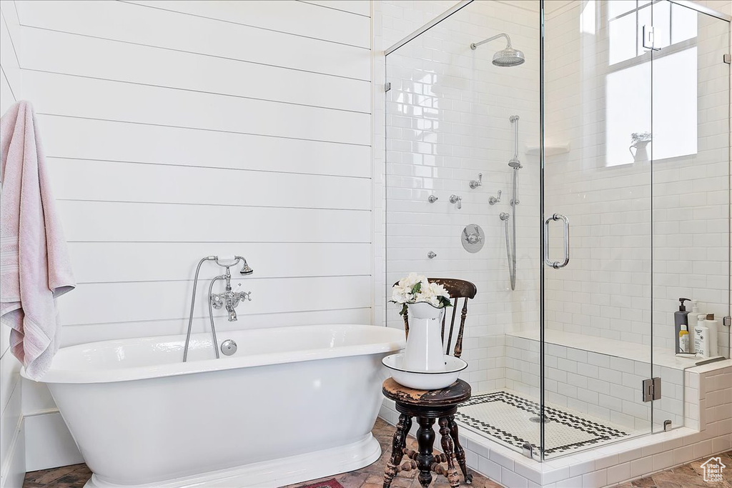 Bathroom with tile floors and separate shower and tub