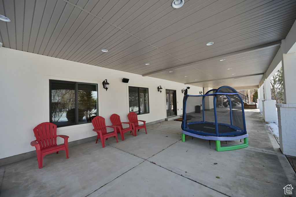 View of patio with a trampoline