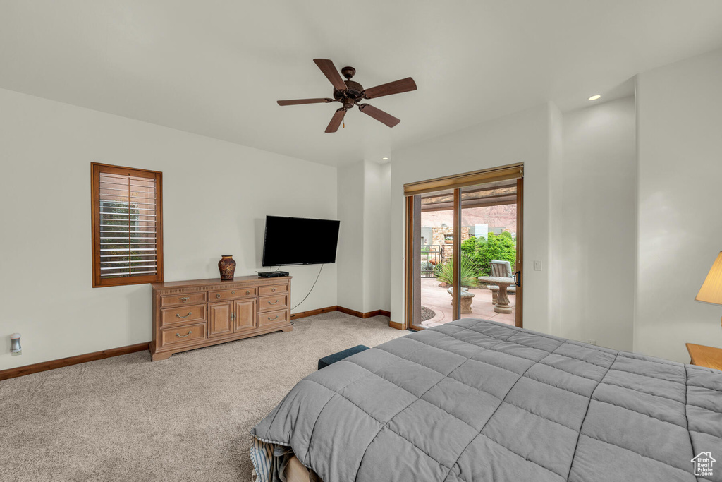 Bedroom featuring ceiling fan, access to exterior, and light colored carpet