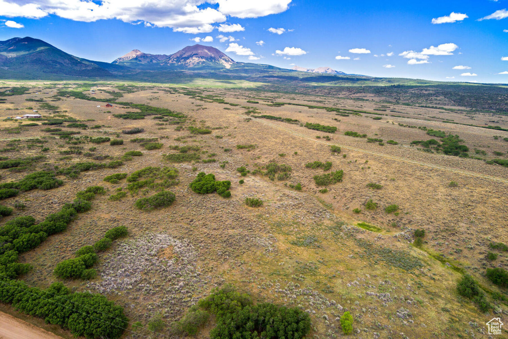 Birds eye view of property with a mountain view