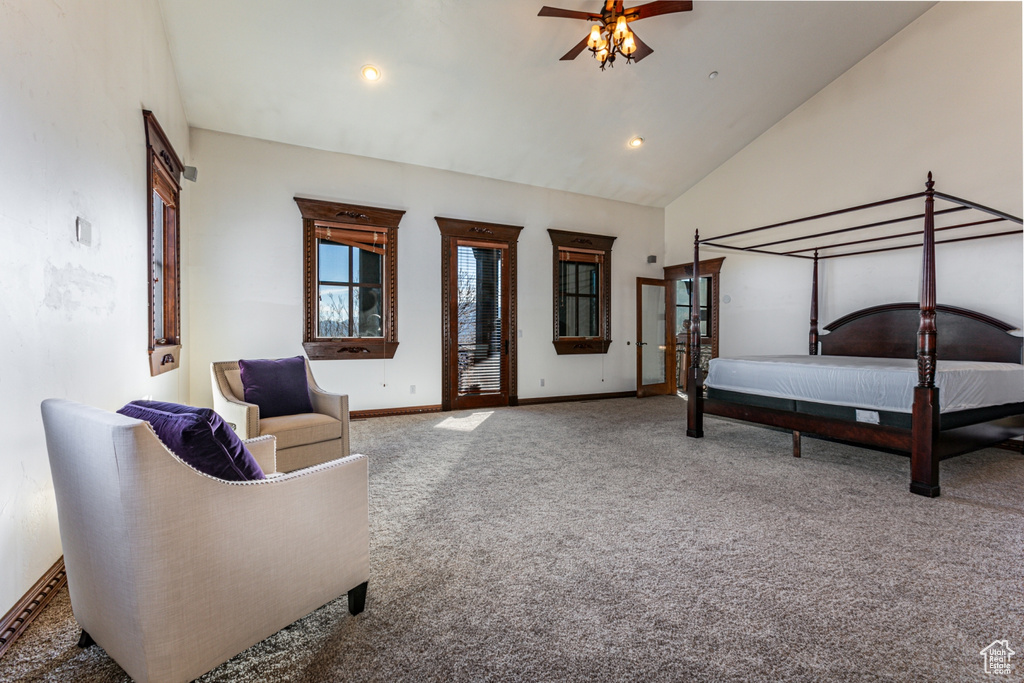 Bedroom featuring carpet floors, ceiling fan, and high vaulted ceiling