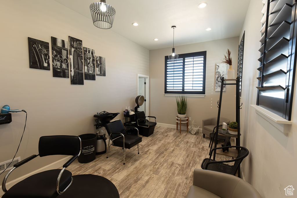 Home office with light hardwood / wood-style floors