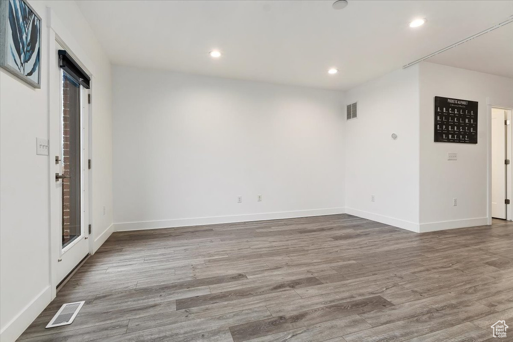 Spare room with hardwood / wood-style floors