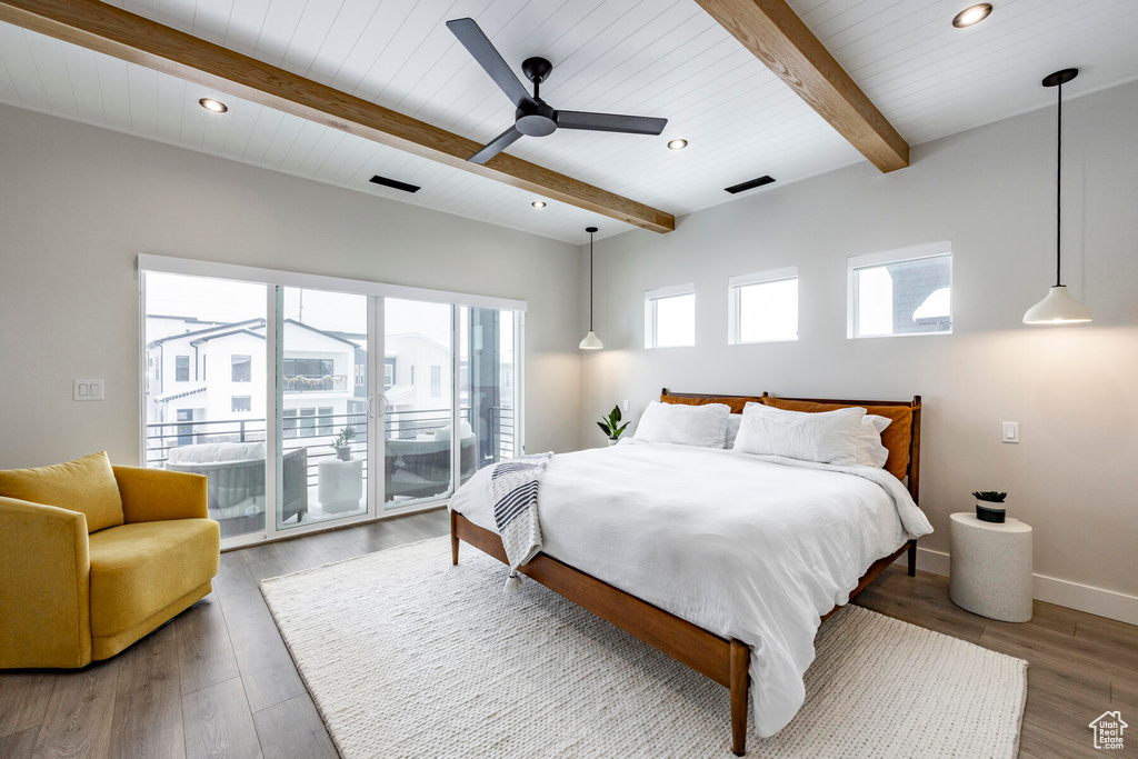 Bedroom with access to exterior, ceiling fan, hardwood / wood-style flooring, and beamed ceiling