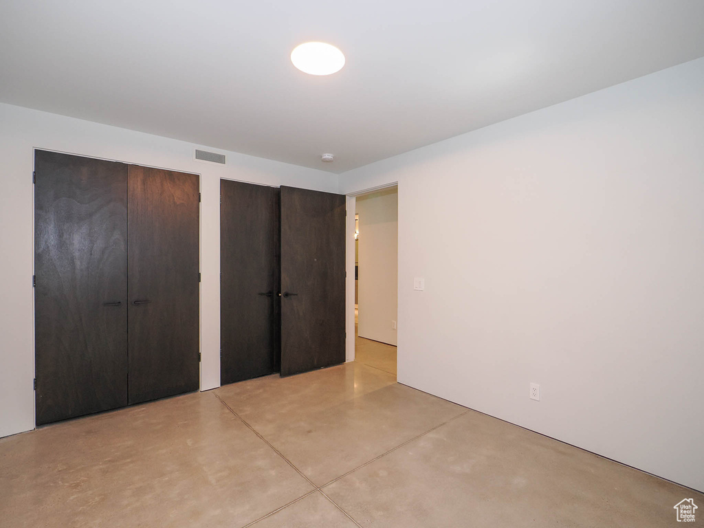 Unfurnished bedroom featuring two closets