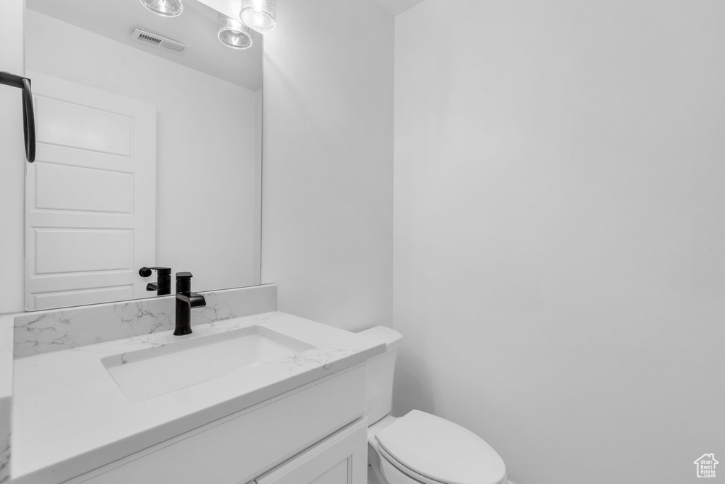 Bathroom with toilet and oversized vanity