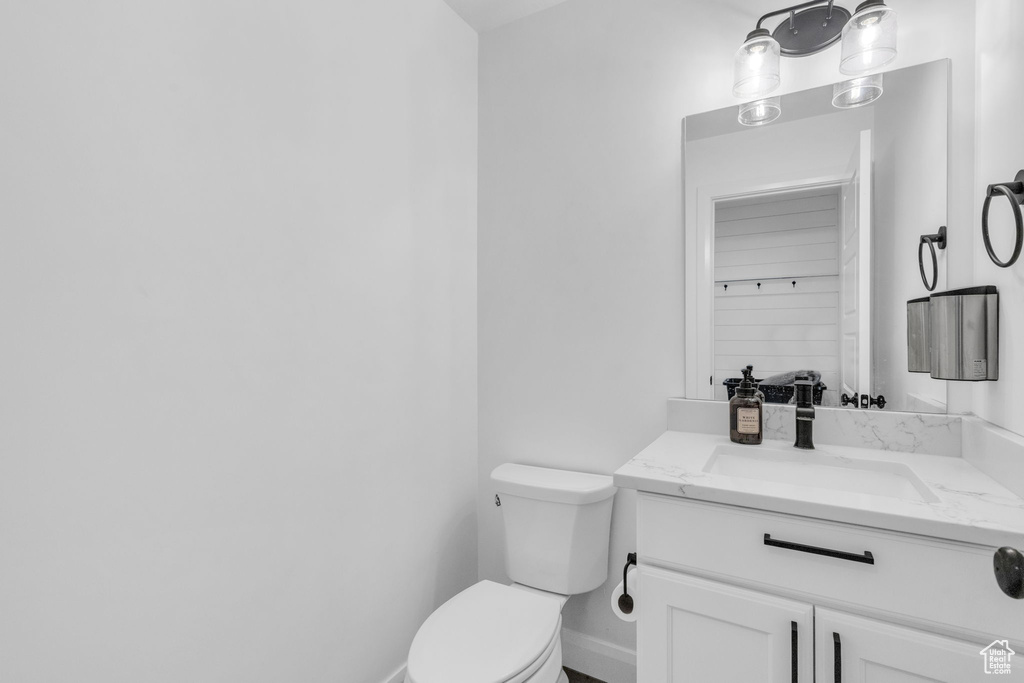 Bathroom featuring oversized vanity and toilet