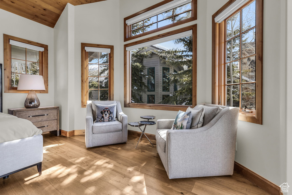 Sitting room featuring light hardwood / wood-style floors and wood ceiling
