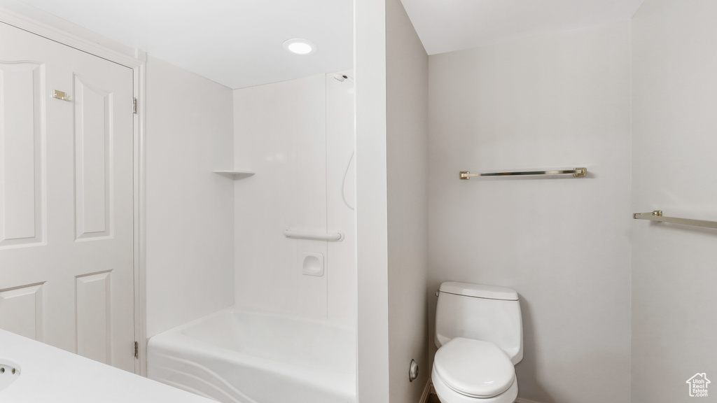 Bathroom with toilet and shower / bathing tub combination