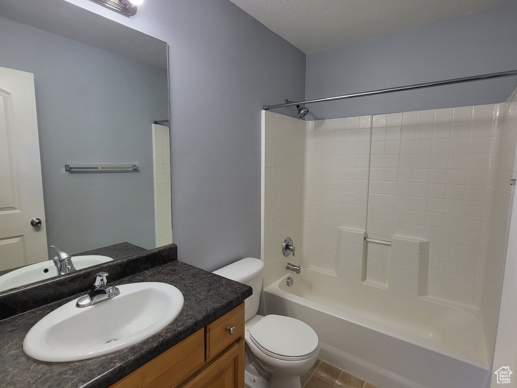 Full bathroom with toilet, shower / bathing tub combination, tile flooring, a textured ceiling, and vanity