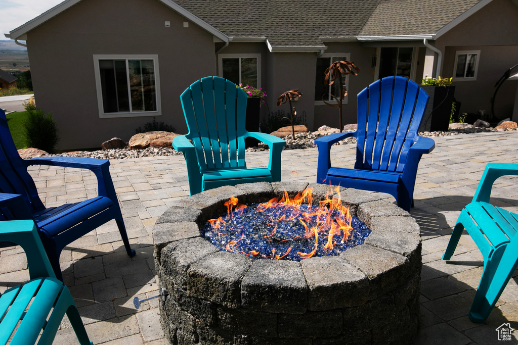 View of patio / terrace featuring an outdoor fire pit