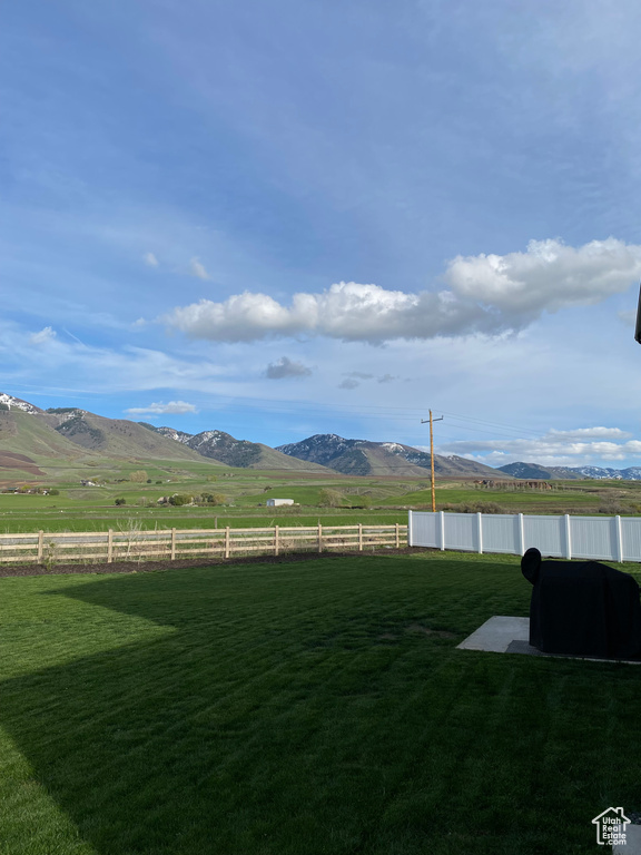 View of yard featuring a mountain view and a rural view