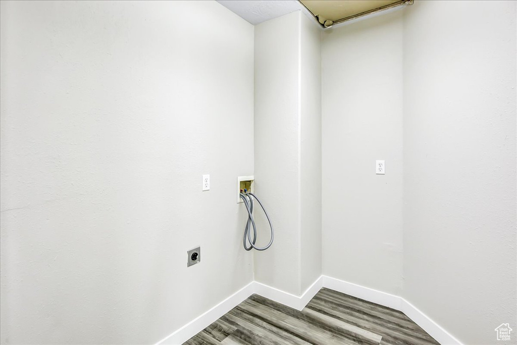 Washroom featuring washer hookup, hookup for an electric dryer, and hardwood / wood-style flooring