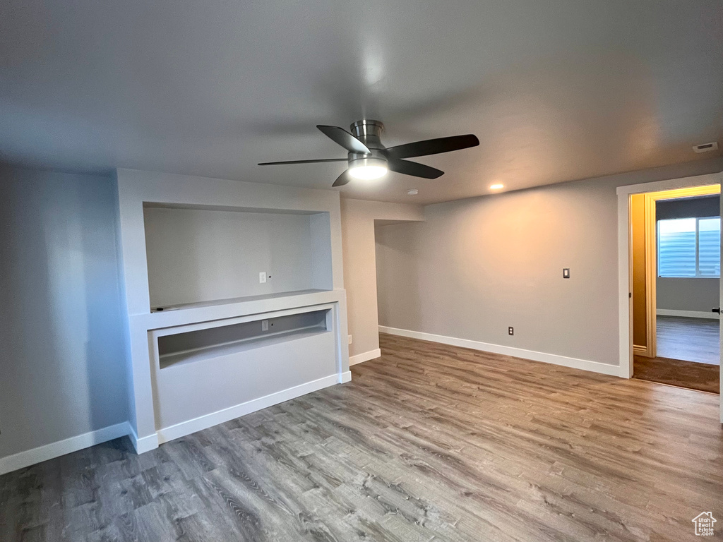 Spare room featuring ceiling fan and hardwood / wood-style flooring