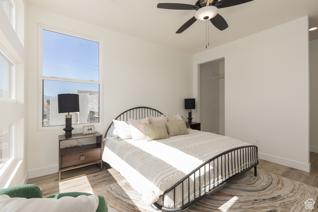 Bedroom featuring light hardwood / wood-style flooring and ceiling fan