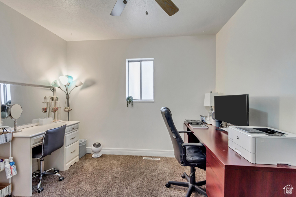 Carpeted office with ceiling fan