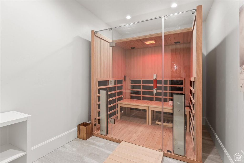 View of sauna / steam room with hardwood / wood-style flooring