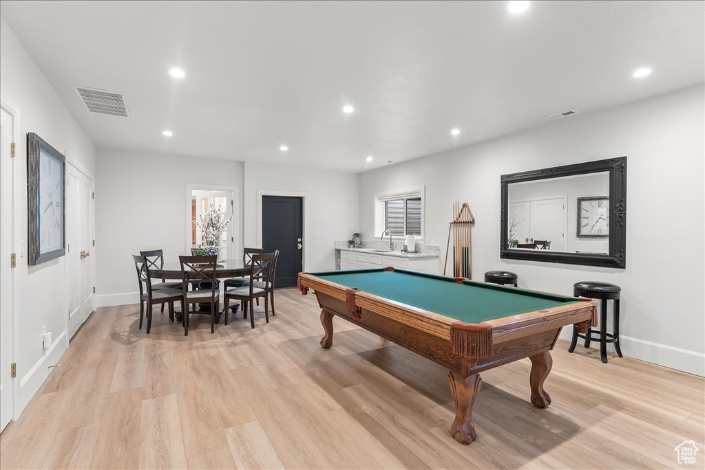 Rec room with billiards, light hardwood / wood-style floors, and sink