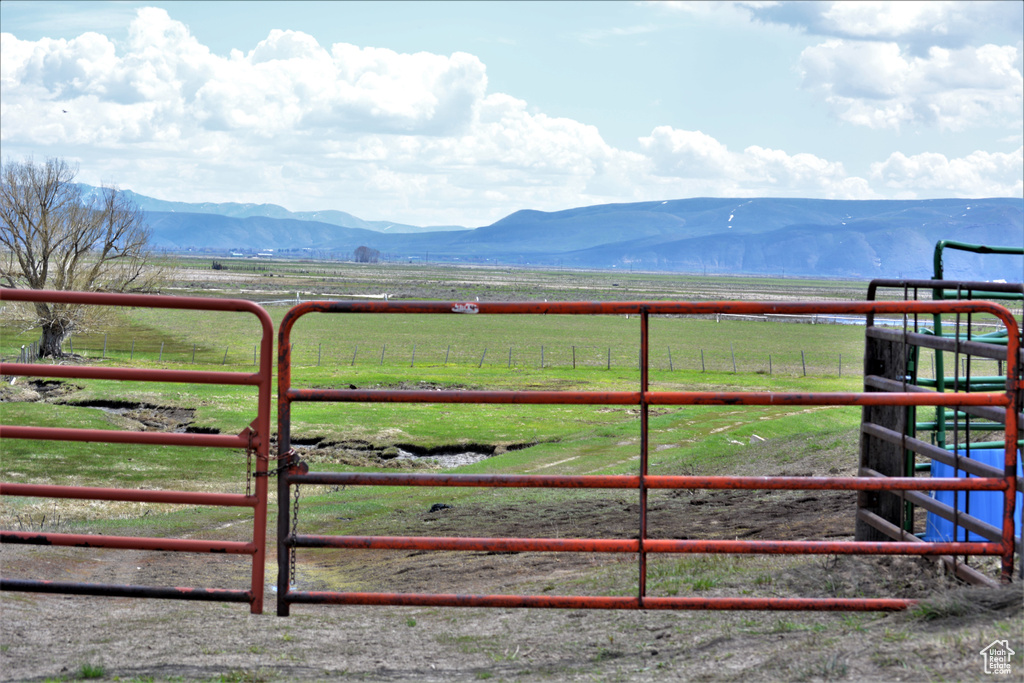View of gate featuring a mountain view and a rural view