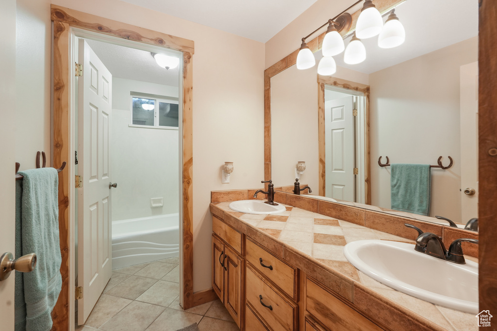 Bathroom with tile floors and dual bowl vanity