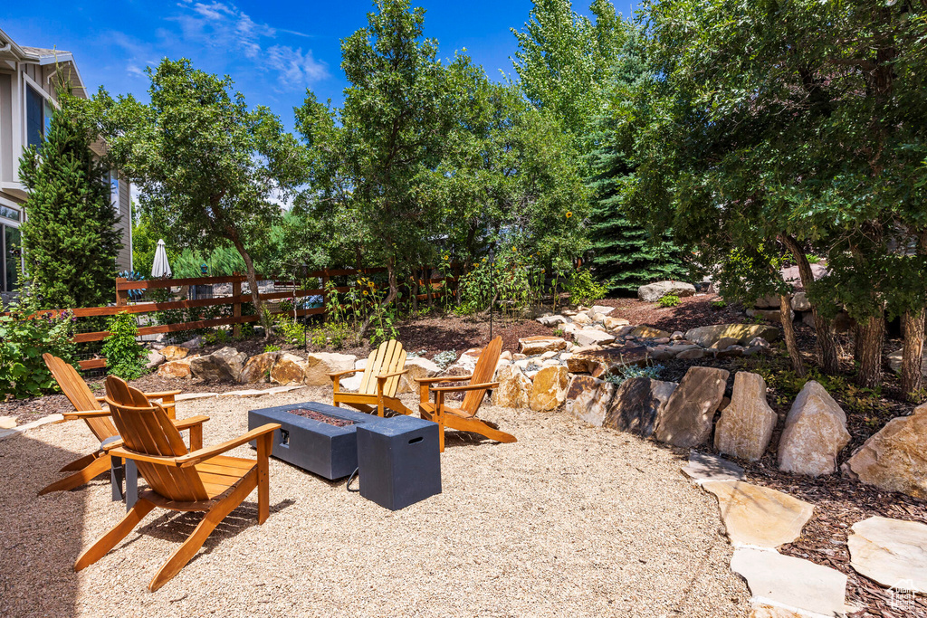 View of yard with an outdoor fire pit