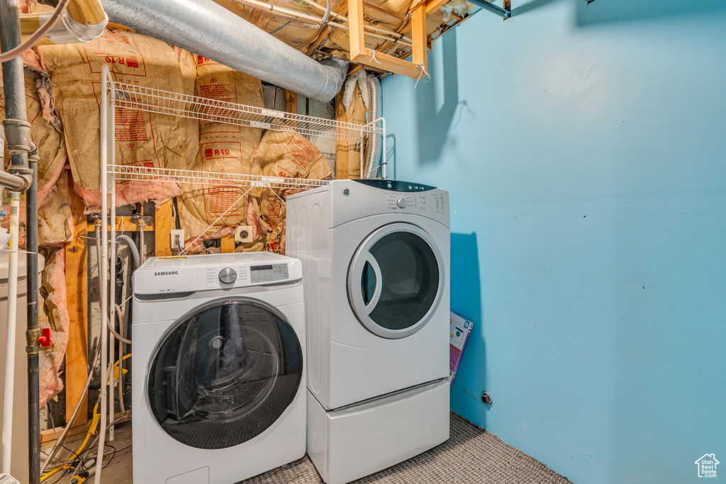 Laundry area with washing machine and clothes dryer, electric dryer hookup, and hookup for a washing machine