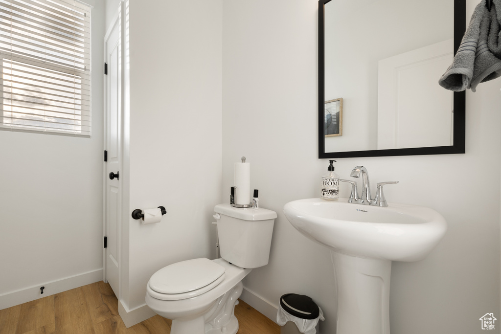 Bathroom featuring toilet and hardwood / wood-style flooring