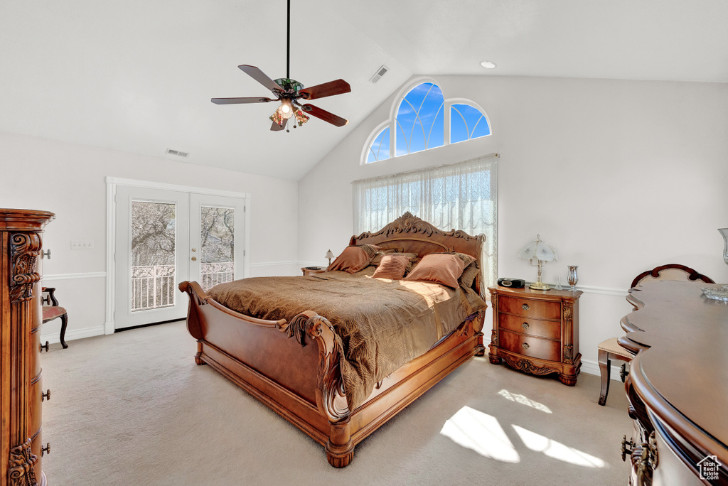 Carpeted bedroom with ceiling fan, access to outside, high vaulted ceiling, and french doors