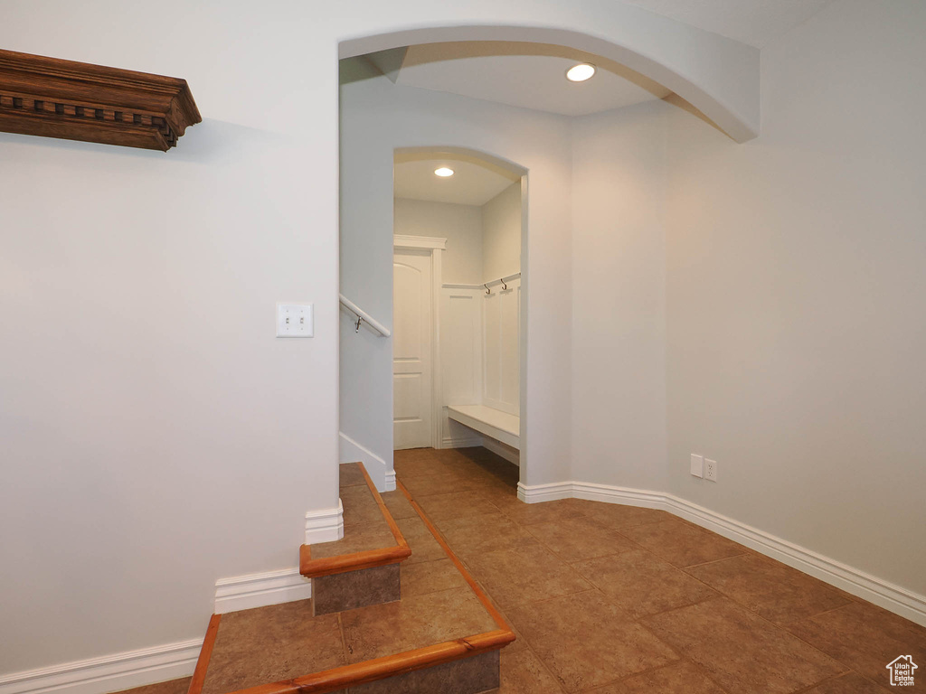 Hallway featuring tile flooring