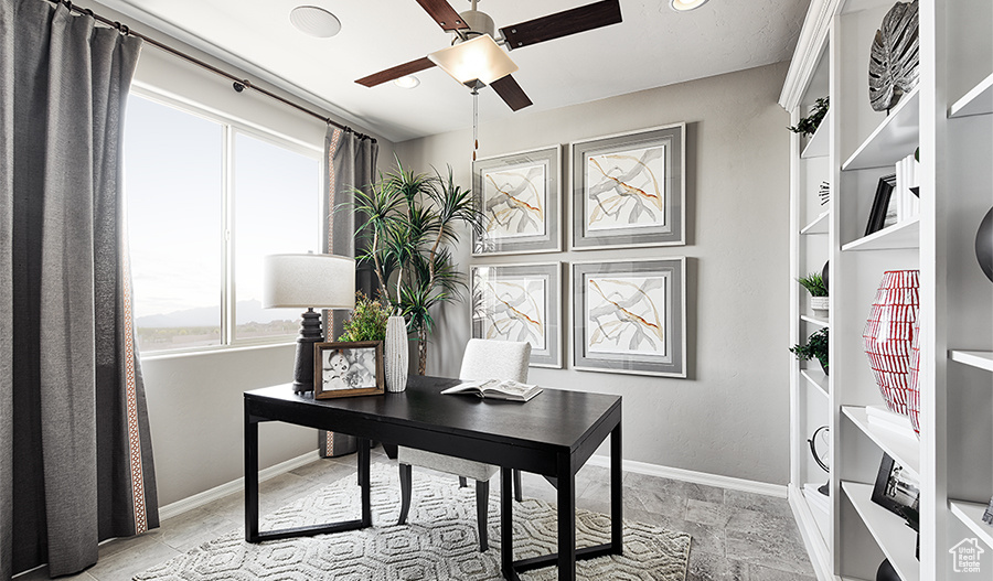 Office area featuring ceiling fan and light tile flooring