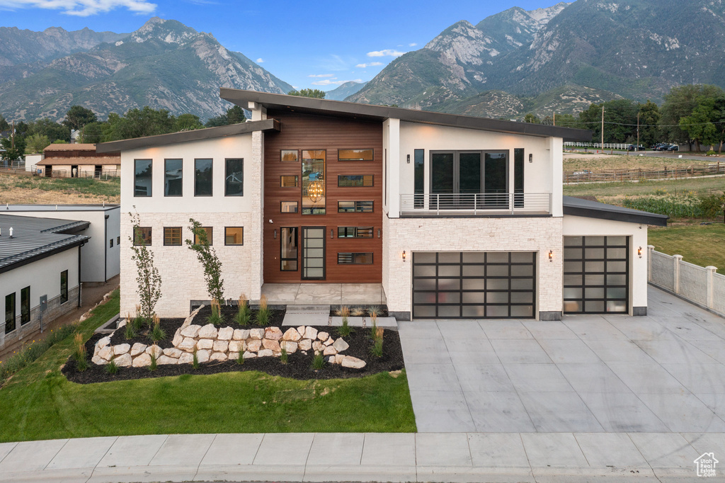 Modern home featuring a mountain view and a garage