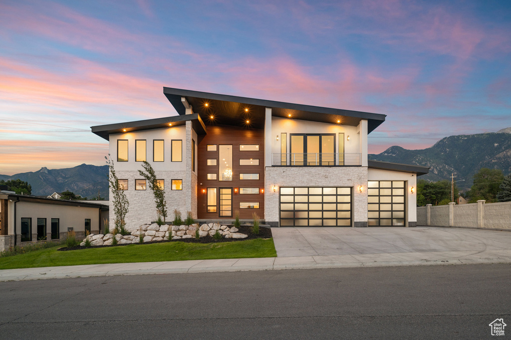 Contemporary home featuring a garage and a mountain view