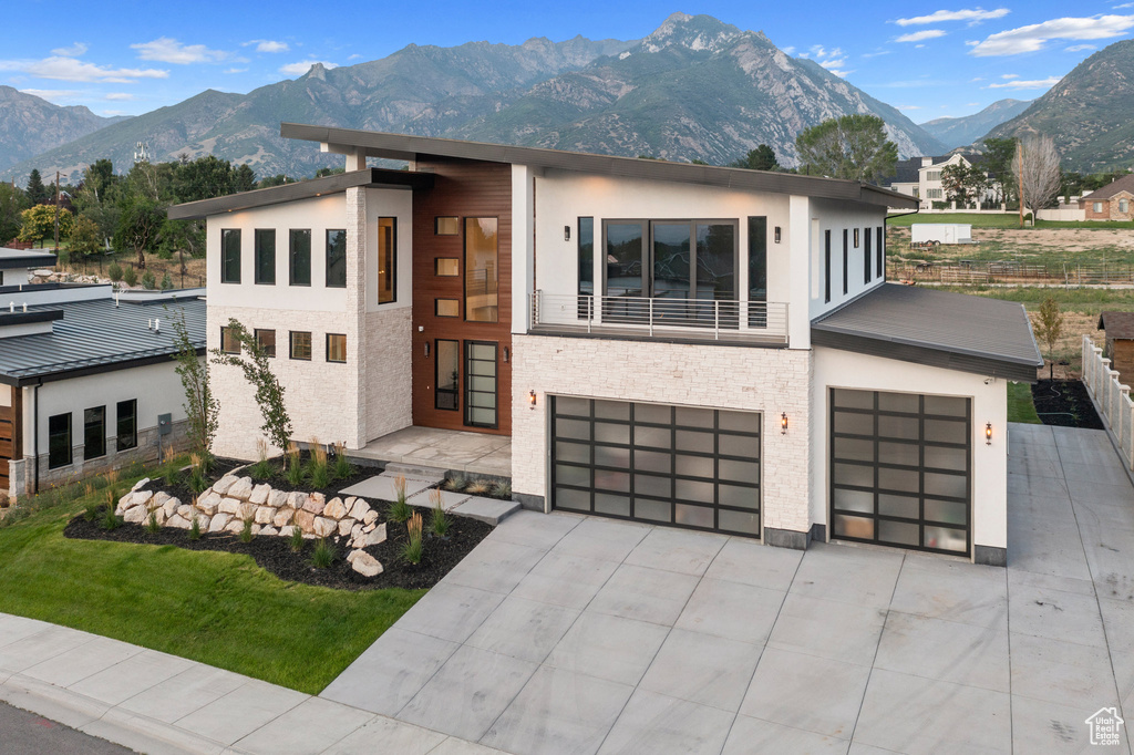 Contemporary house with a mountain view and a garage