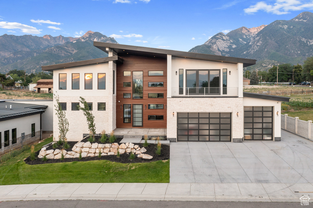 Modern home with a mountain view and a garage