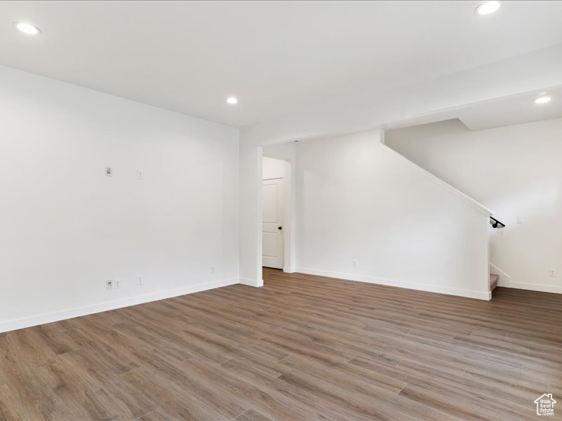 Unfurnished room with hardwood / wood-style flooring