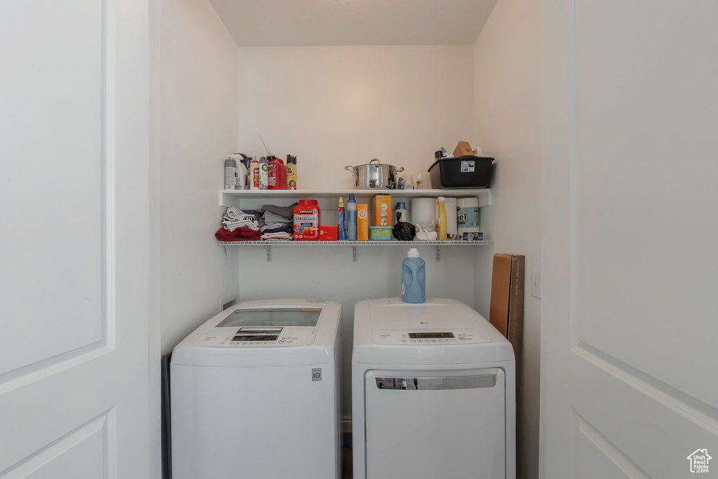 Washroom featuring washer and clothes dryer