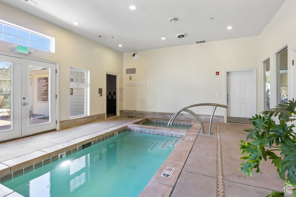 View of pool featuring french doors