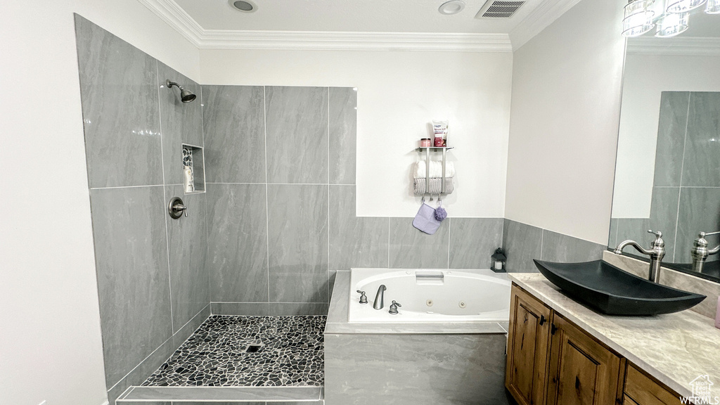 Bathroom with plus walk in shower, ornamental molding, and vanity