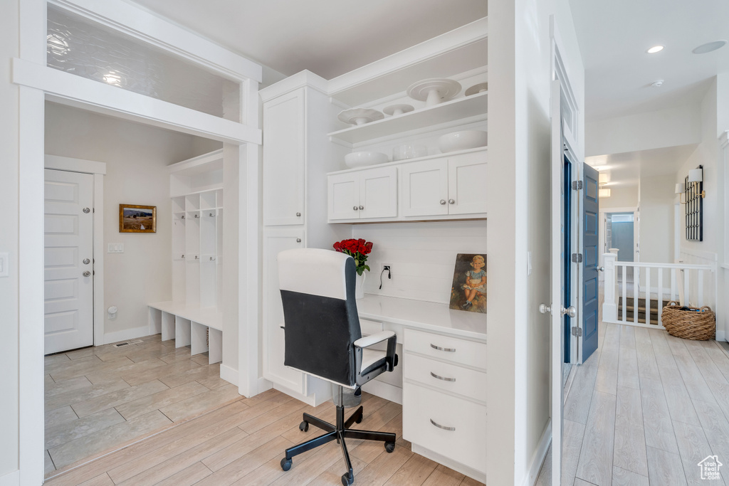 Office space featuring light hardwood / wood-style flooring