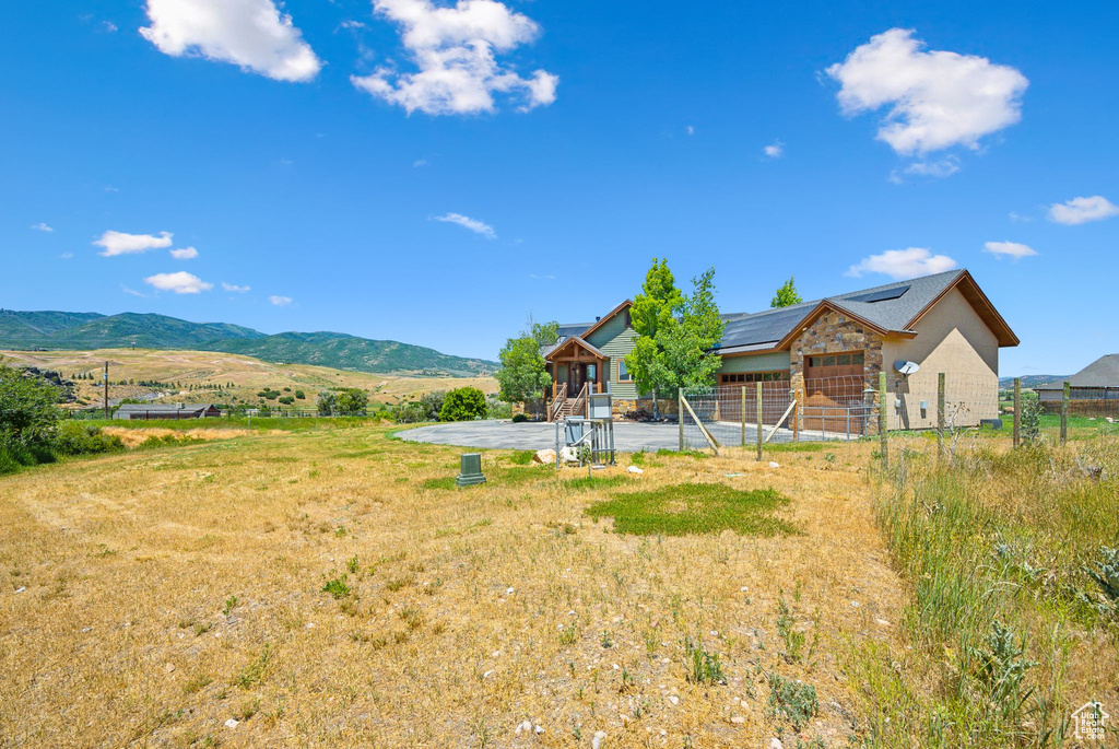 View of yard featuring a mountain view and a patio