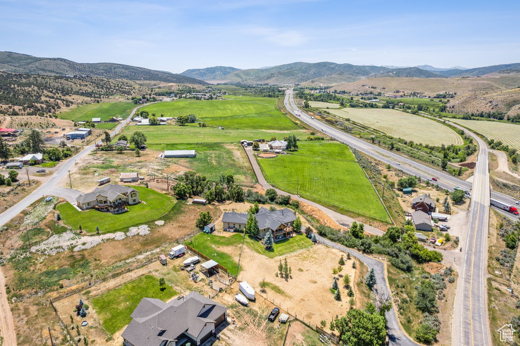 Birds eye view of property with a mountain view