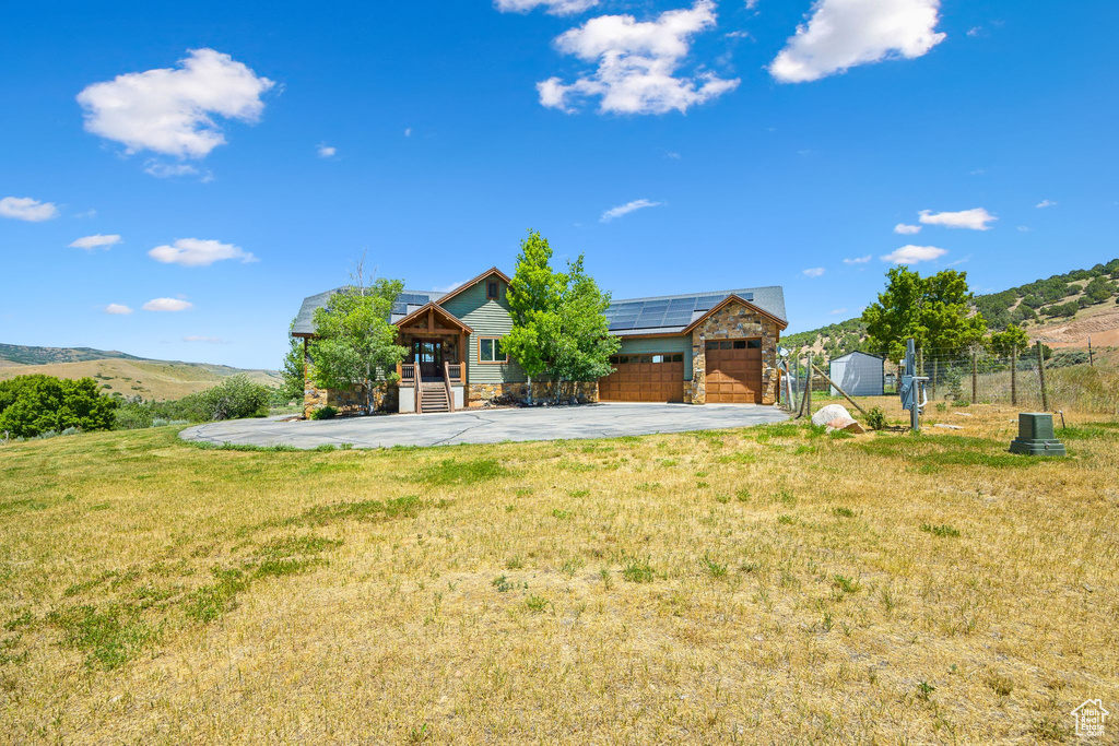 Exterior space featuring a garage and a mountain view