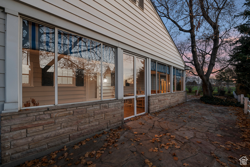 Property exterior at dusk with a patio