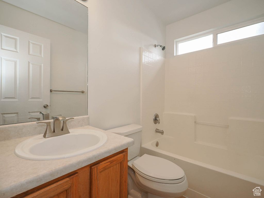Full bathroom featuring shower / washtub combination, toilet, and vanity